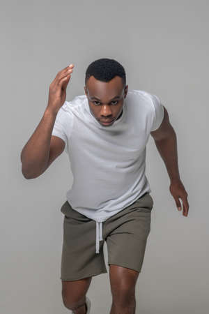 Serious african american in sportswear running