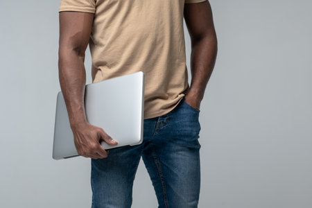 Man with laptop, face not visibleの写真素材