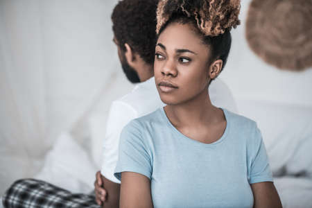 African American in depressed mood with back to husbandの写真素材