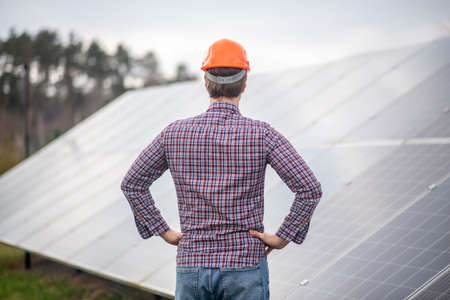 Man in safety helmet with back to cameraの写真素材