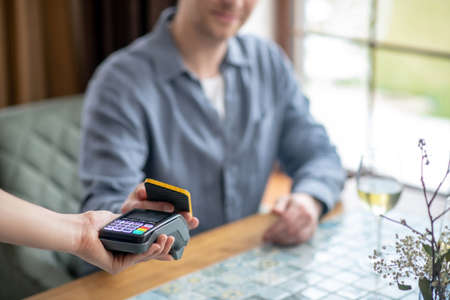 Man with smartphone making check payment.の写真素材