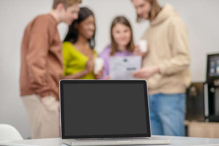 Group of students talking in office of youth organizationの写真素材