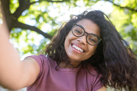 A cute dark-skinned young girl smiling nicely