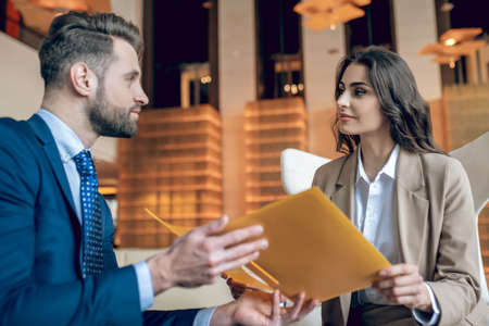 Business partners discussing the project and looking involvedの写真素材