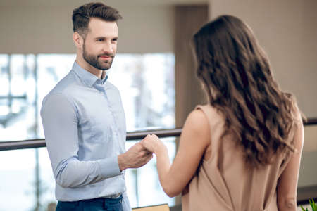 Man and woman meeting in the restaurant and looking excitedの写真素材