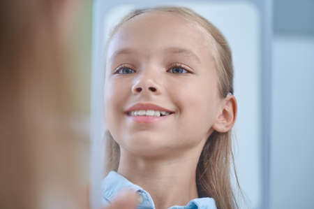 Happy shining face of elementary school girlの写真素材