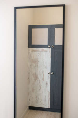 Designer wardrobe reflected in the mirrorの写真素材