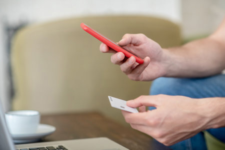 Close up picture of somebody paying online by card