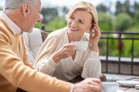 Female having a conversation with her male spouse at breakfastの写真素材