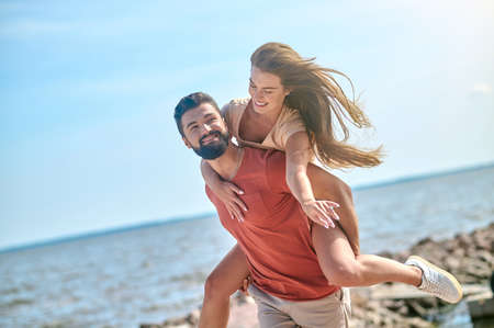A happy couple spedning time at the seasideの写真素材