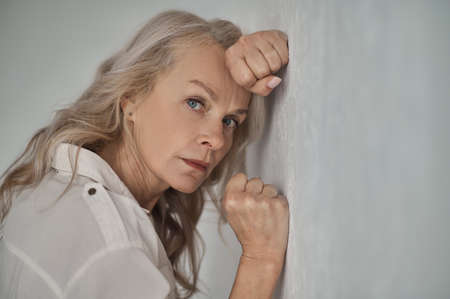 Cheerless woman staring in front of herの写真素材