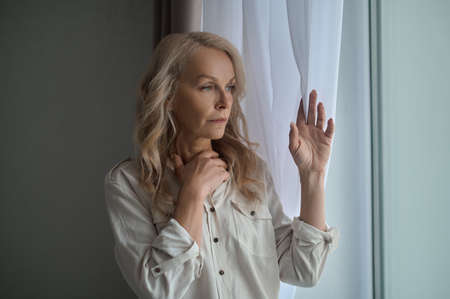 Attractive dejected woman pondering over a problem