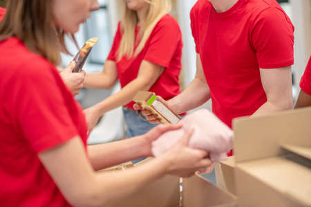 Young people working in a donations distribution centerの写真素材