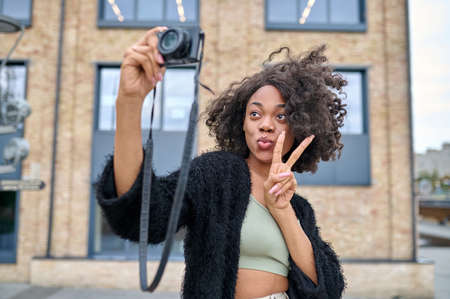 Cute young woman feeling happy and looking excitedの写真素材