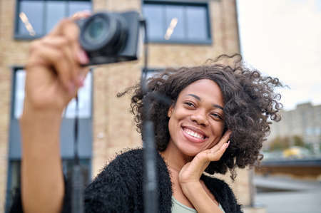 Cute young woman feeling happy and looking excitedの写真素材