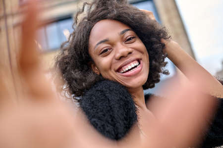 Cute young woman feeling happy and looking excited