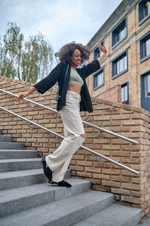 A stylish young woman on the steps