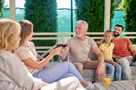 A family talking after dinner and looking peaceful