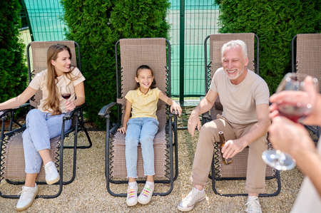 Family gathered together and spending a good timeの写真素材