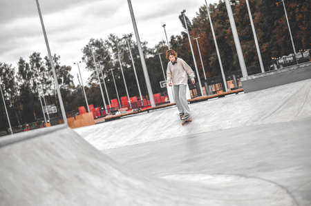 Girl riding up on sketboard in parkの写真素材