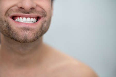 Close up picture of a man showing his teethの写真素材