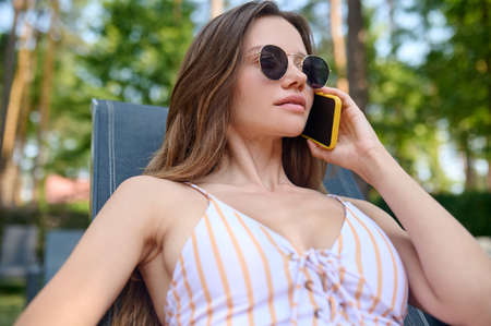 Pretty young woman talking on the phone