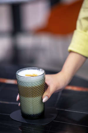Close up picture of a glass with cappuccino