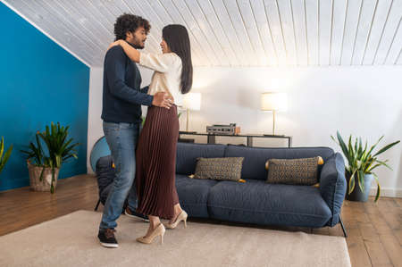 Man and woman dancing in pair sideways to camera