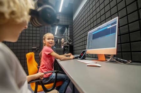 Group of children recording a song in the studioの写真素材