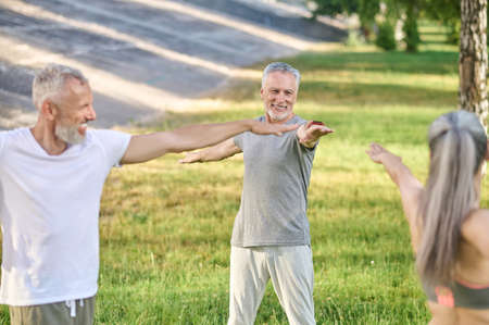 Group of mid aged people having a workout in the park