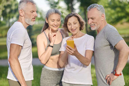 Group of mid aged people making selfieの写真素材