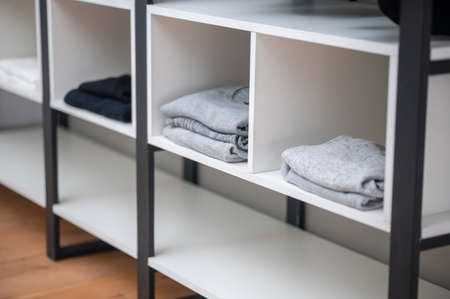 Several items of clothing placed into the wardrobeの写真素材