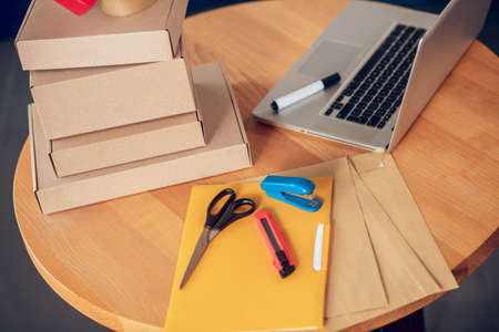 Set of packaging materials and a portable computer on the tableの写真素材