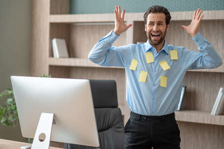 A manager looking stressed and overloaded with tasks