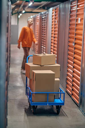 Worker picking out ordered goods in the warehouse