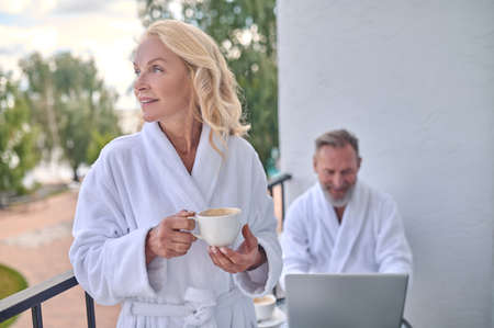 A happy mid aged couple at the balconyの写真素材