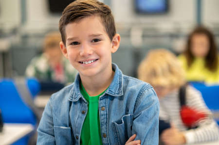 Boy smiling confidently at camera in classの写真素材