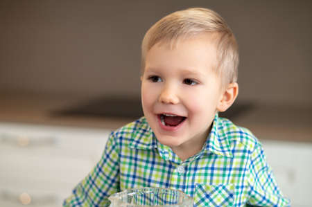 Cute open-mouthed little boy staring at something in the distance