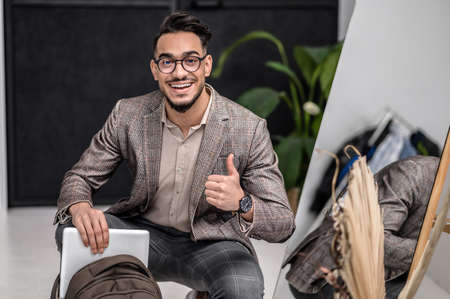 A good-looking young stylish man feeling good