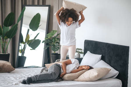 Two siblings playing together and having funの写真素材