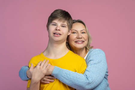 Woman hugging guy looking at cameraの写真素材