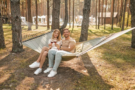 Couple drinking red wine in the recreation parkの写真素材