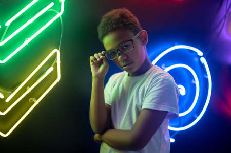Cute African American teenager in stylish spectaclesの写真素材