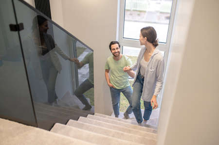 Top view of woman and man climbing stairsの写真素材