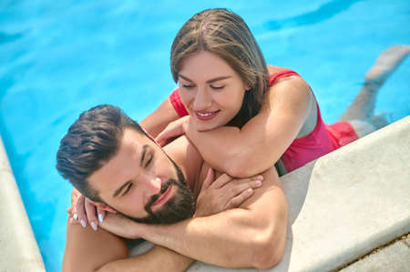 Romantic lady and her boyfriend in the waterの写真素材