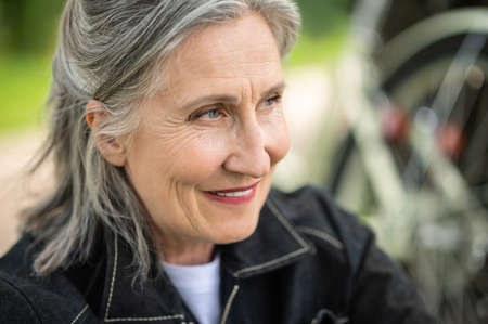 Portrait of a mature woman smiling and looking aside