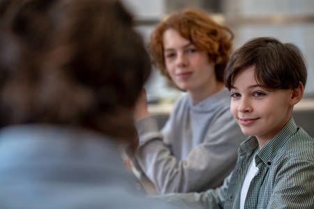 Teens and their teacher in a chool canteen