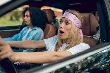 Girls in the car having car accident and looking scared