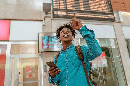 Guy looking up pointing his finger up