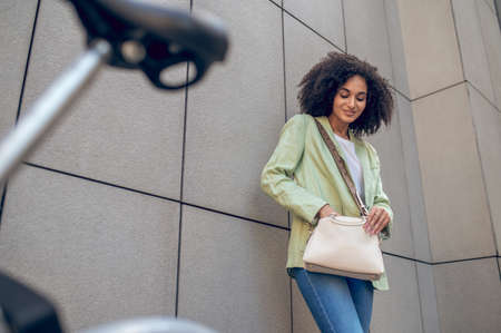 Pretty african american woman standing near the building